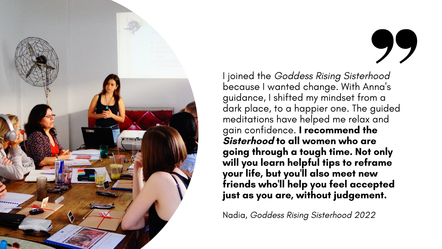 Nadia's review about Anna Krjatian's Goddess Rising Sisterhood with an image of Anna standing at the head of the table where a group of people sit and listen as one person speaks.